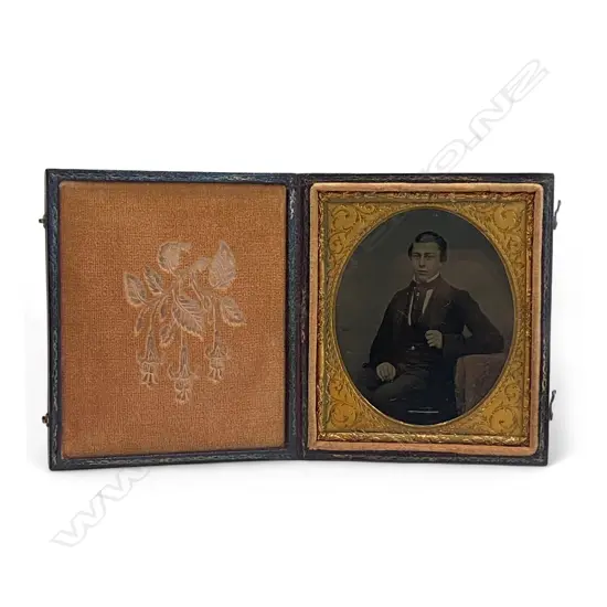 Leather covered cased ambrotype - seated man with gilt tie pin and fob,